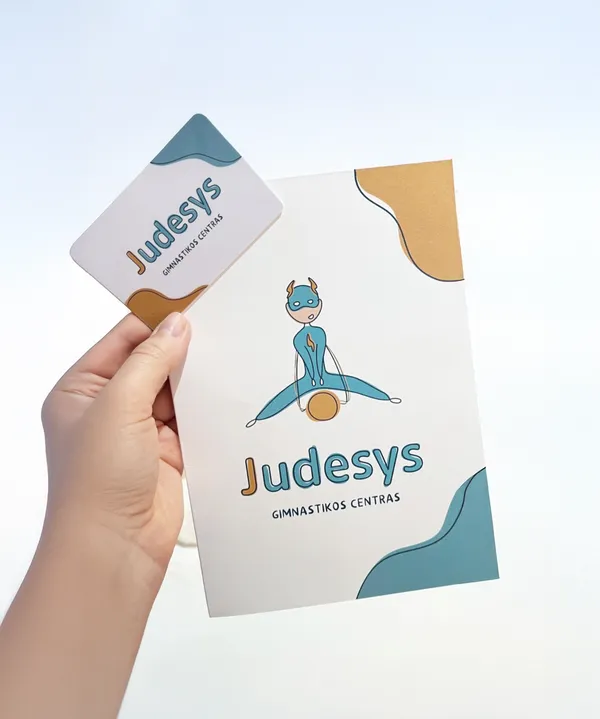 Judesys gymnastics center brand identity featuring business card and letterhead with playful character mascot