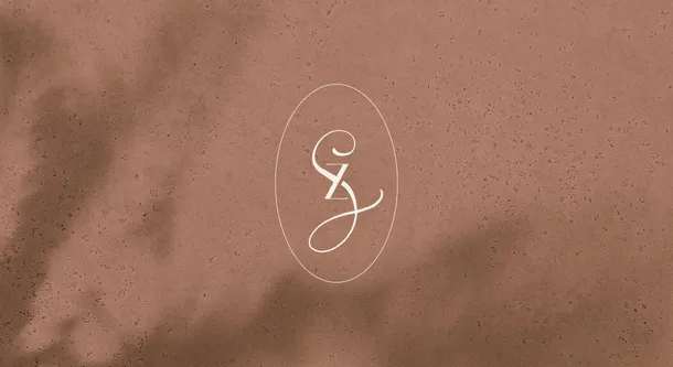 Sizan beauty salon logo design with white script monogram on terracotta textured background